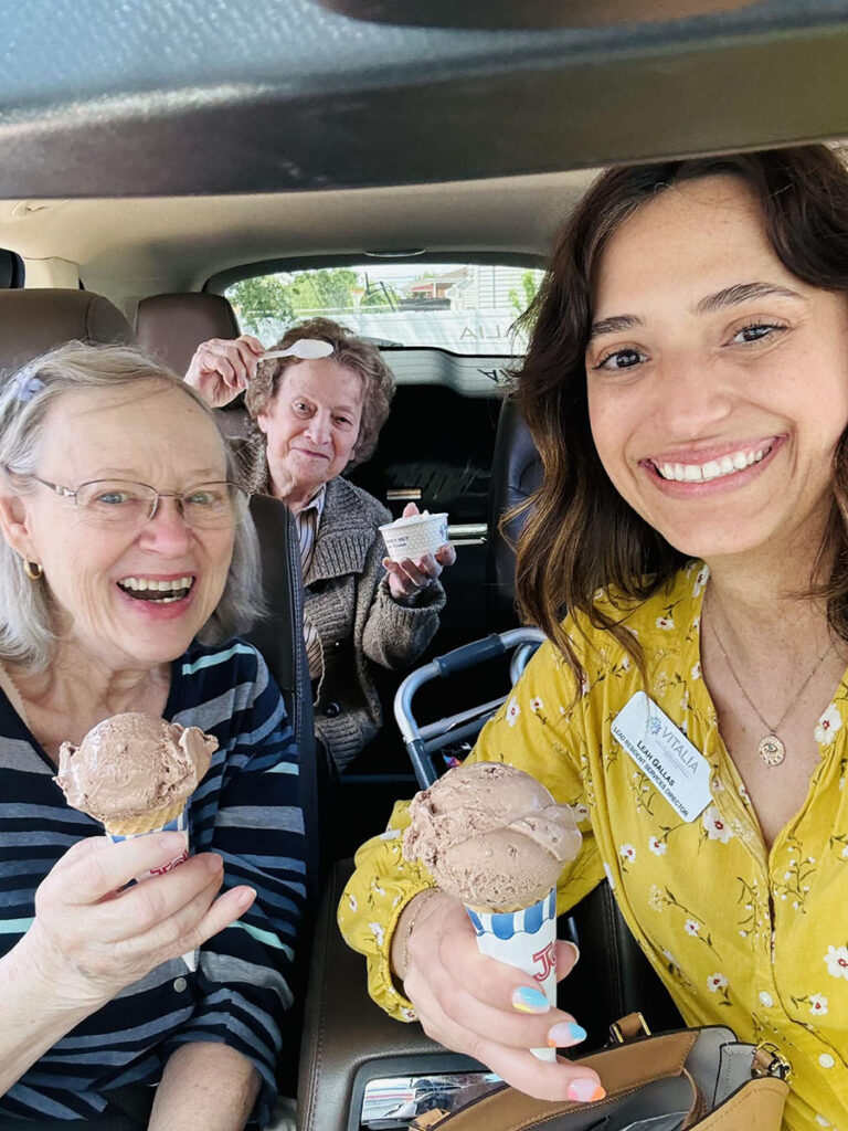 The Resident Service Director and two senior residents indulge in ice cream from Honey Hut Ice Cream during an errand run. Big Smiles.