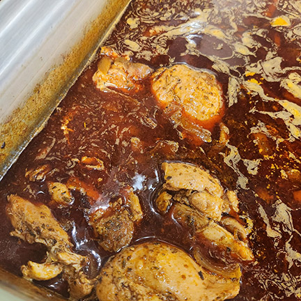 A large batch of a chef-prepared chicken dish at Vitalia Rockside.
